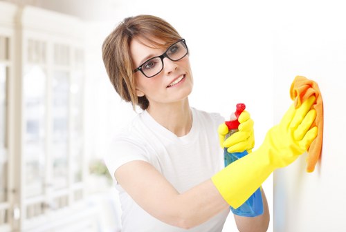 Carpet cleaner working safely with insured equipment in a home